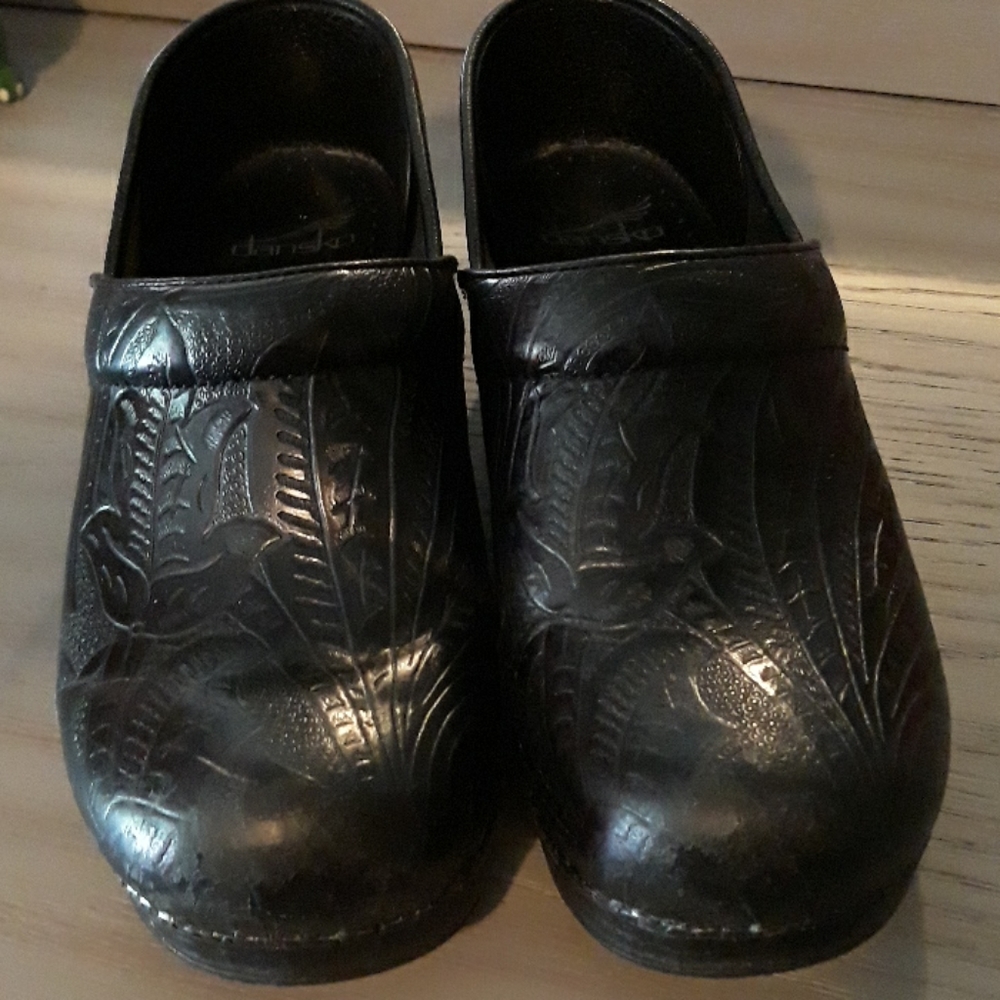 Dansko tooled leather clogs